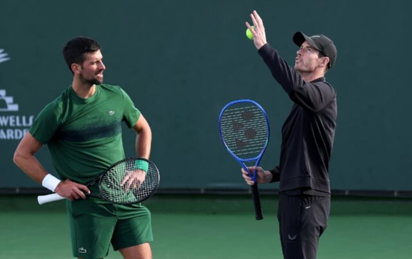 Novak Djokovic and coach Andy Murray work on the Serbian star's serve during practice prio