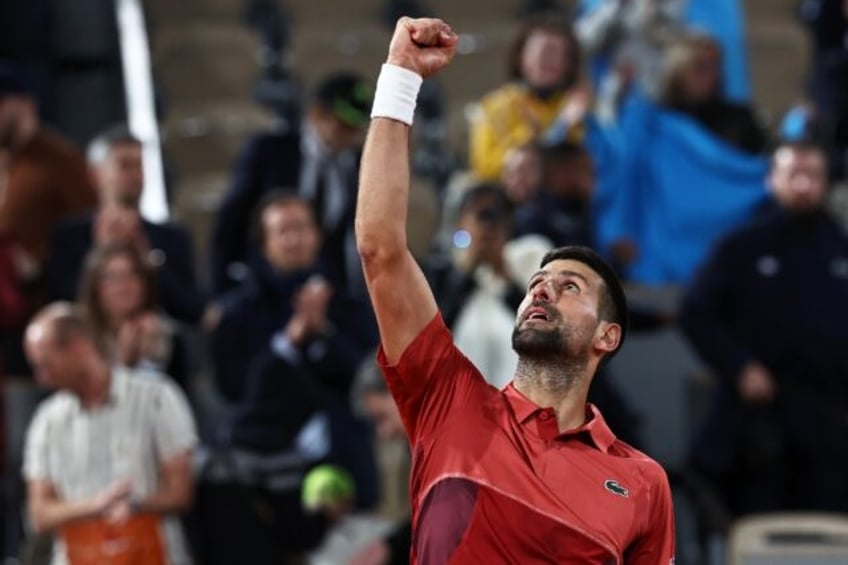 Winning moment: Novak Djokovic celebrates vicotry over Pierre-Hugues Herbert