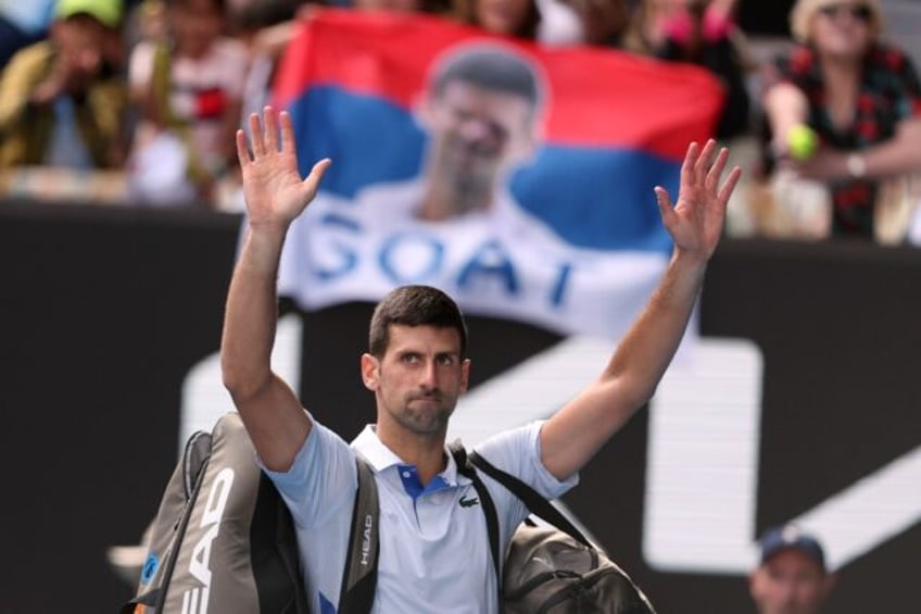 Novak Djokovic walks off court after losing against Jannik Sinner in the Australian Open semi-finals