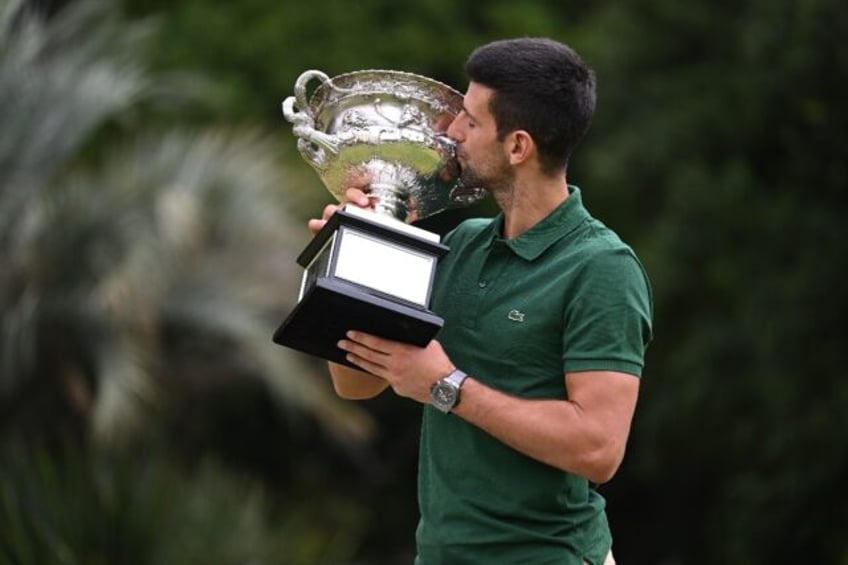 Record breaker: Novak Djokovic with the Australian Open trophy in January