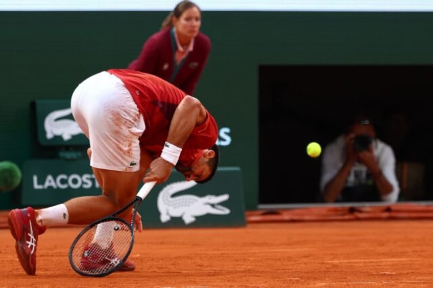 Knockout blow: Novak Djokovic was forced to pull out of the French Open with an injury pic