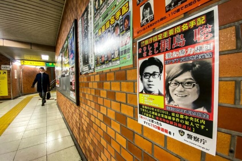 A poster in a train station in the Chuo district of Tokyo shows the face of Satoshi Kirish