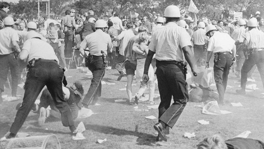 Police reroute demonstrators as they try to clear Grant Park during the Democratic National Convention