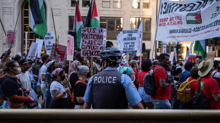 CHICAGO, ILLINOIS - AUGUST 18: Pro-Palestine protesters march ahead of the Democratic National Convention on August 18, 2024 in Chicago, Illinois. The convention runs August 19-22. (Photo by Jim Vondruska/Getty Images)