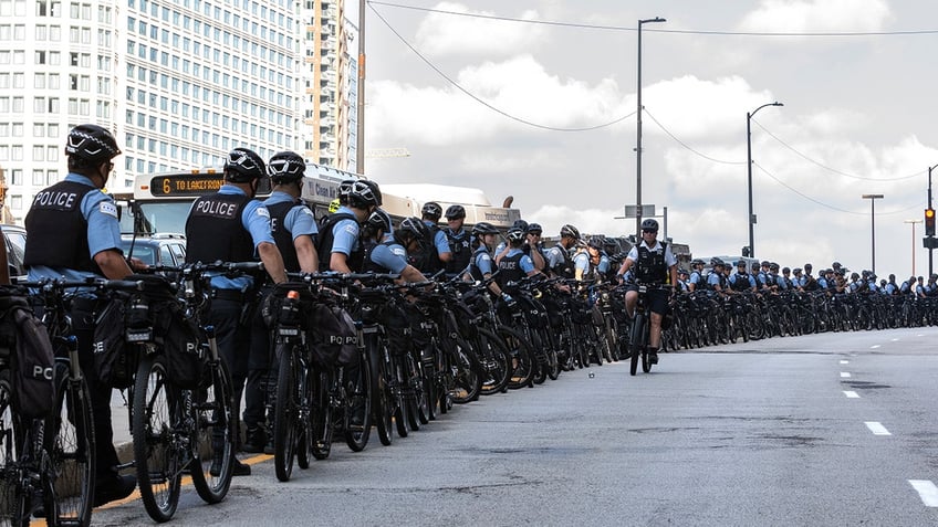 CHICAGO, ILLINOIS - AUGUST 18: Police on bicycles stage on Upper Wacker drive for a Pro-Palestinian protest ahead of the Democratic National Convention on August 18, 2024 in Chicago, Illinois.