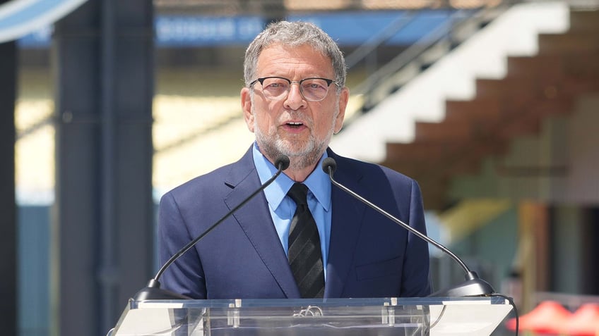 Charley Steiner speaks during a ceremony 