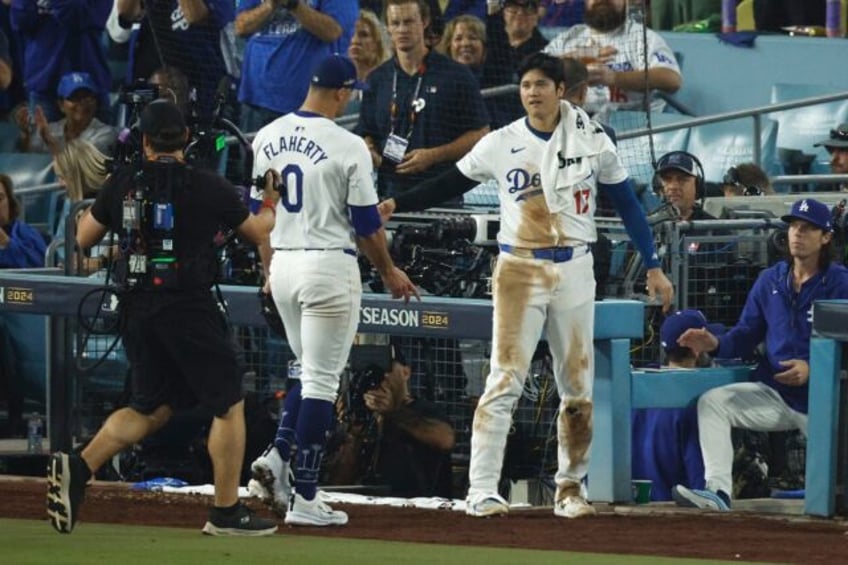 Los Angeles Dodgers pitcher Jack Flaherty is congratulted by teammate Shohei Ohtani after