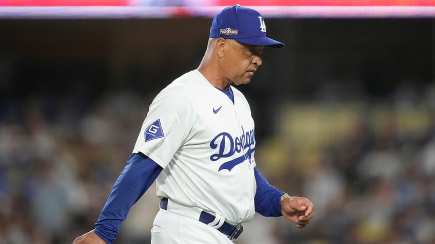 Dave Roberts walks back to the dugout