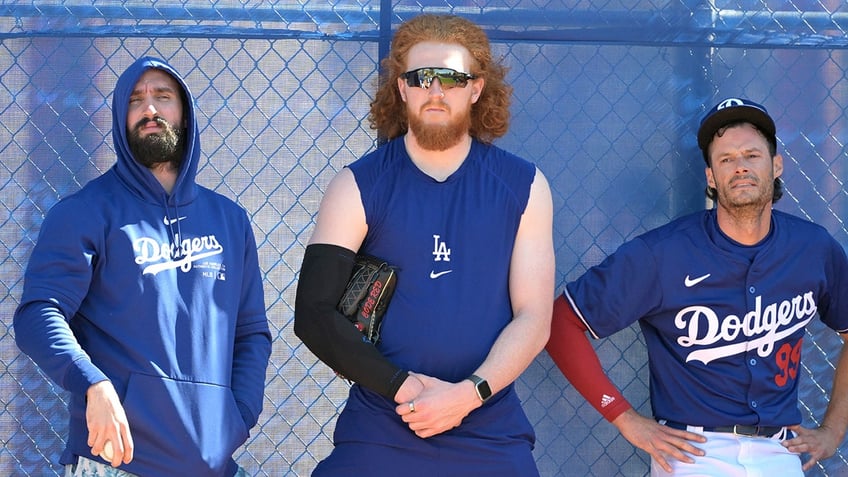 Dustin May stands between Tony Gonsolin and Joe Kelly