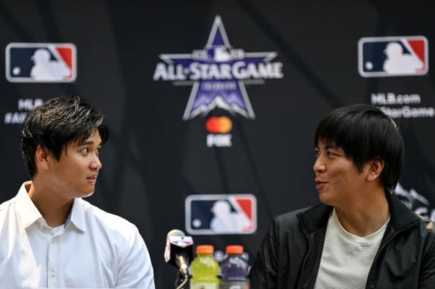 Shohei Ohtani of the Los Angeles Angels and interpreter Ippei Mizuhara speak in a press conference revealing the All Star starting lineups at...