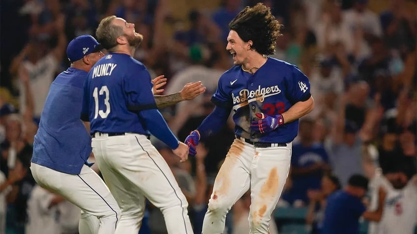 dodgers rally for four runs in ninth inning walk off blue jays in tenth inning on james outmans double