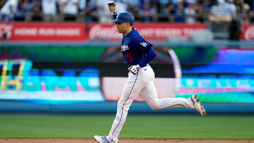 dodgers rally for four runs in ninth inning walk off blue jays in tenth inning on james outmans double