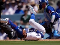 Dodgers star Mookie Betts suffers broken left hand when hit by a pitch