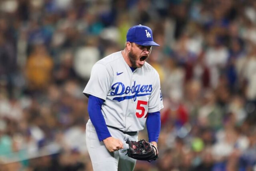 dodgers wrap up nl west title for 10th time in 11 years with 6 2 win over mariners in 11 innings