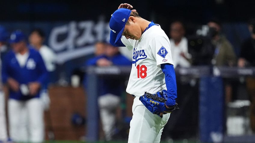 Yoshinobu Yamamoto reacts during a game