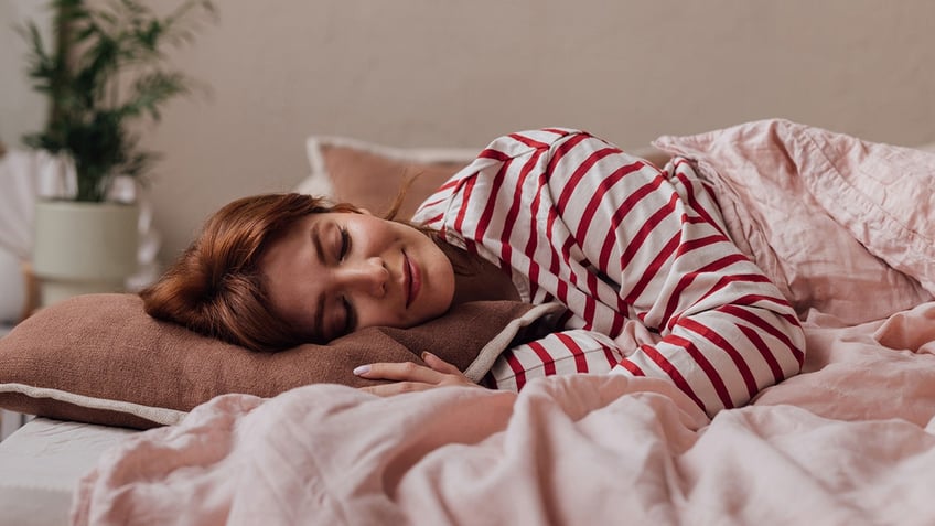woman sleeping in red pajamas