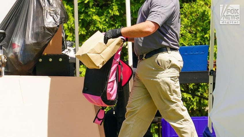 New York State and Suffolk County investigators remove items from Rex Heuermann’s home in Massapequa Park