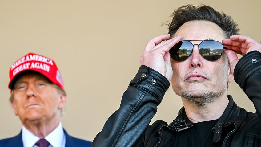 Donald Trump, left in red MAGA hat, Elon Musk at right