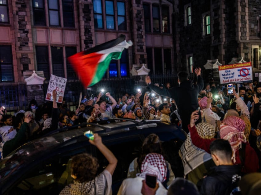 Protestors chant outside The City College Of New York (CUNY) one day after the NYPD cracke