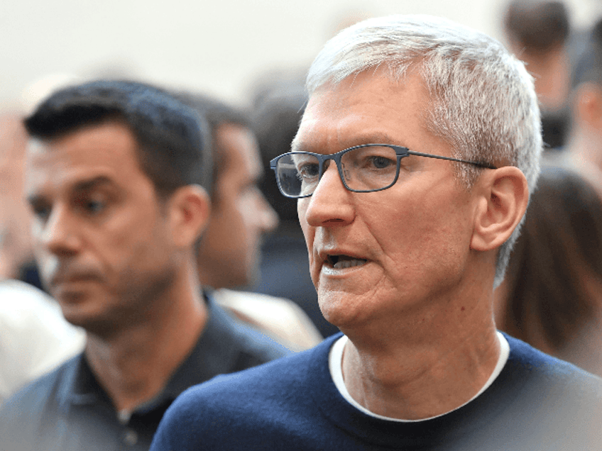 Apple CEO Tim Cook speaks with attendees during an Apple (JOSH EDELSON/AFP/Getty Images)pr
