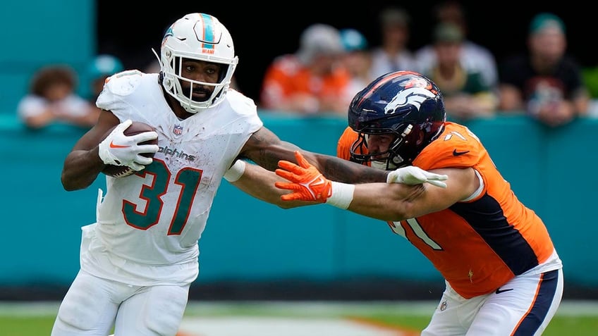 dolphins drop 70 points on broncos in historic victory