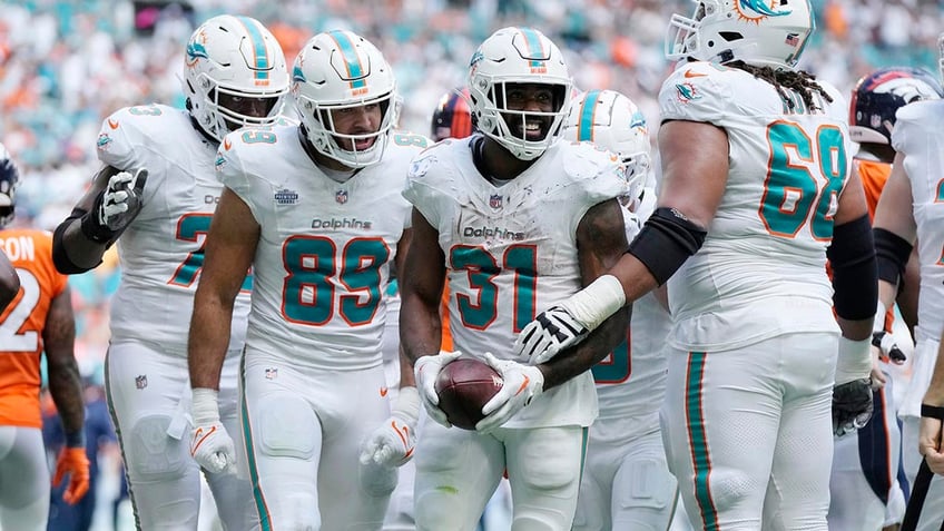 dolphins drop 70 points on broncos in historic victory