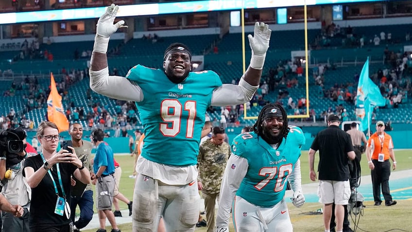 Emmanuel Ogbah celebrates during a game