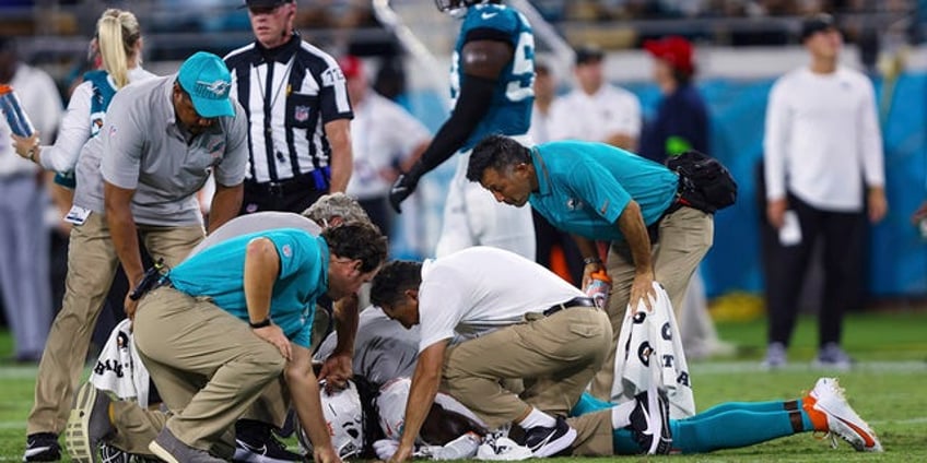 dolphins jaguars game suspended after daewood davis suffers scary injury