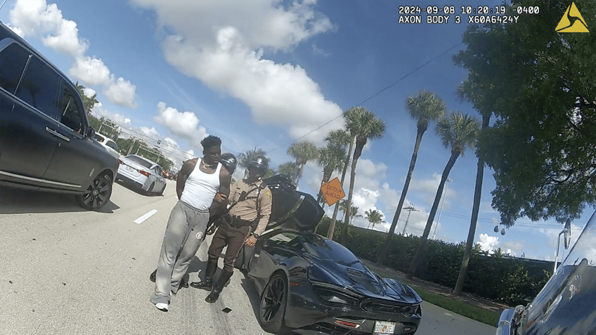 Tyreek Hill in handcuffs