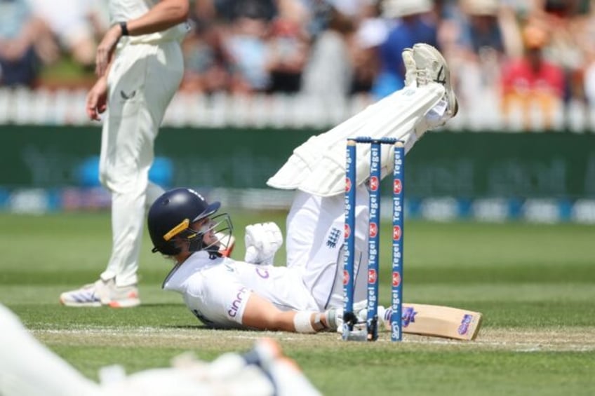 England's Jacob Bethell falls over on day two of the second Test cricket match with New Ze