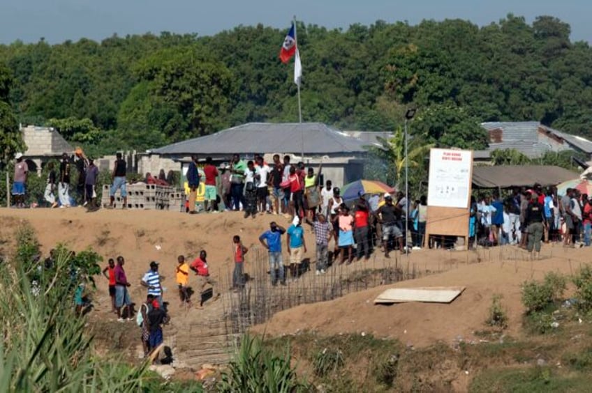 dominican republic to reopen its border to essential trade but not haitians