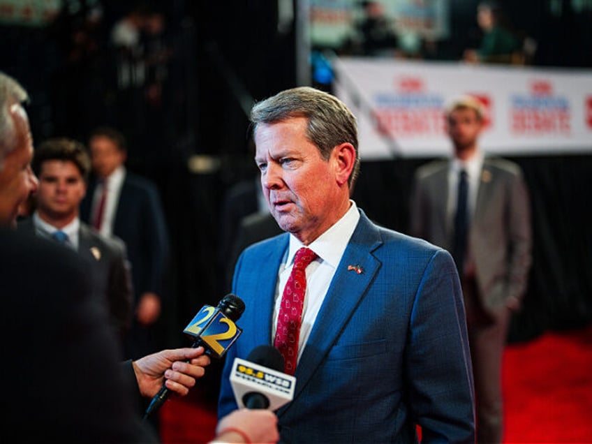 Atlanta, Georgia - June 27: Georgia Gov. Brian Kemp (R) talks with journalists in the spin