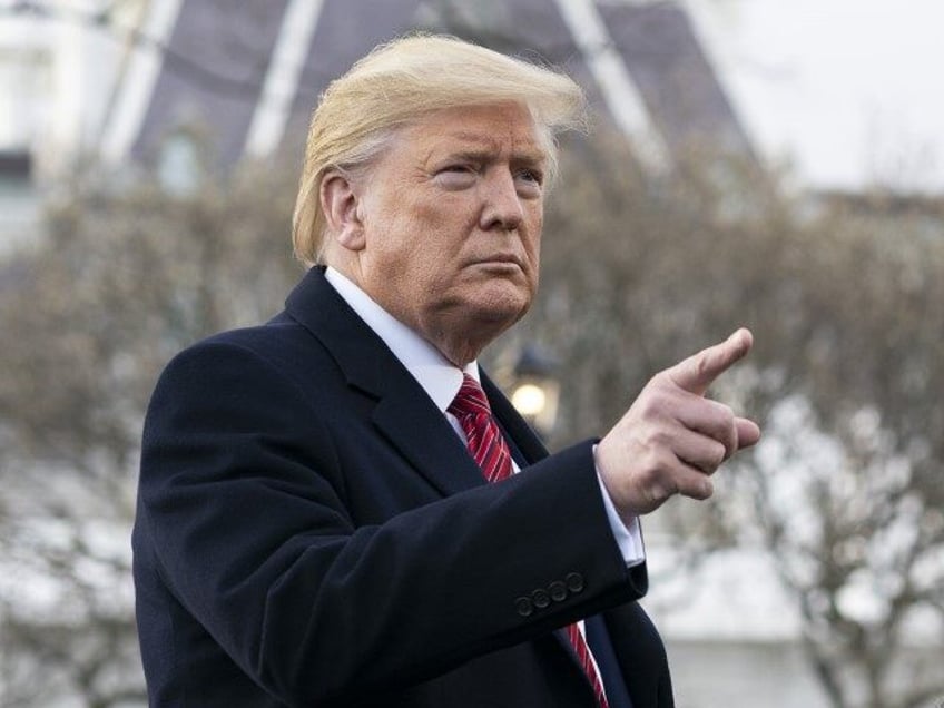 President Donald J. Trump speaks with members of the press along the South Lawn driveway o