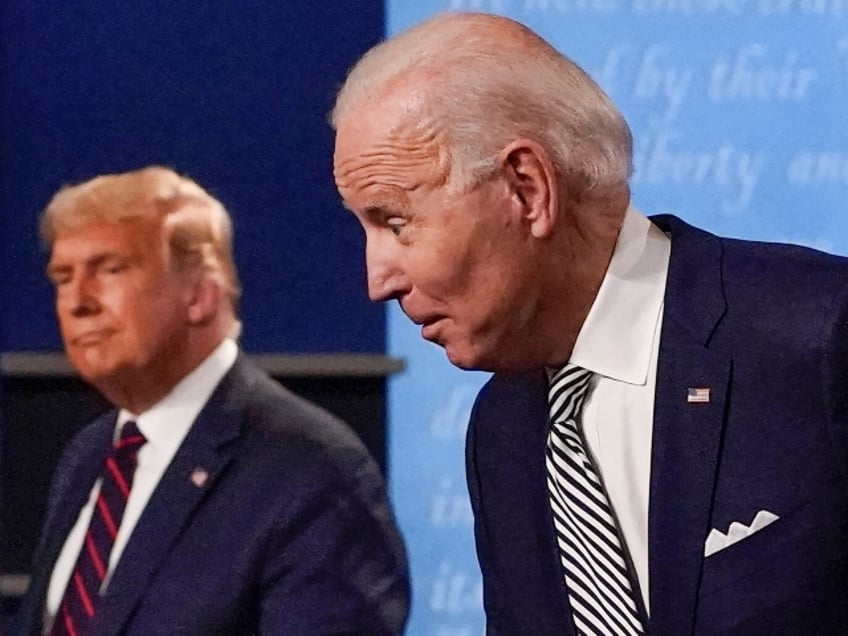 FILE - In this Sept. 29, 2020, photo, from left, first lady Melania Trump, President Donald Trump, Democratic presidential candidate former Vice President Joe Biden and Jill Biden during the first presidential debate at Case Western University and Cleveland Clinic, in Cleveland, Ohio. A book by Donald Trump's ex-chief of staff says Trump tested positive for COVID-19 three days before his first debate in September 2020. (AP Photo/Julio Cortez, File)