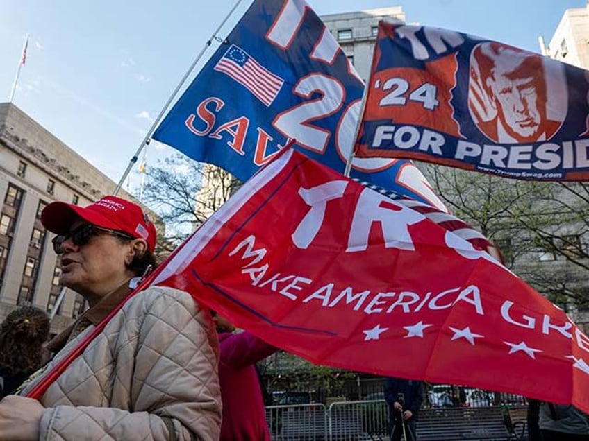 Trump supporters, police and media gather outside of a the Manhattan Criminal Courthouse f