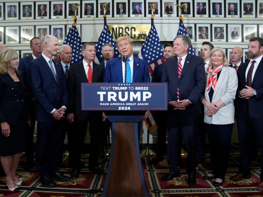 Republican presidential candidate former President Donald Trump speaks with reporters at t