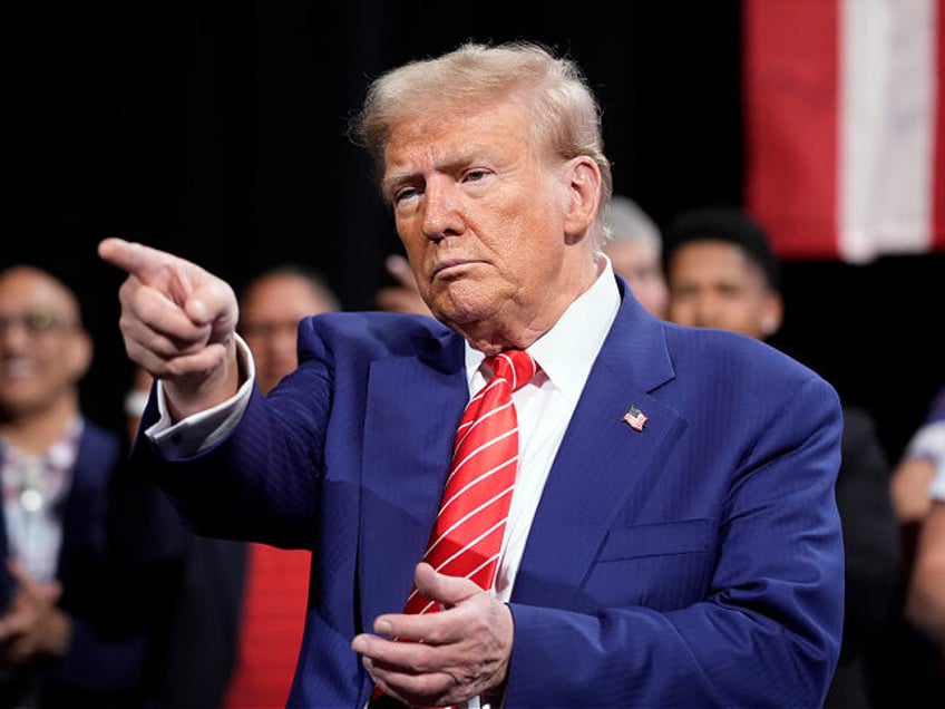 Republican presidential nominee former President Donald Trump gestures at a campaign event