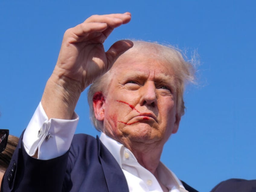 Republican presidential candidate former President Donald Trump waves from the stage as he