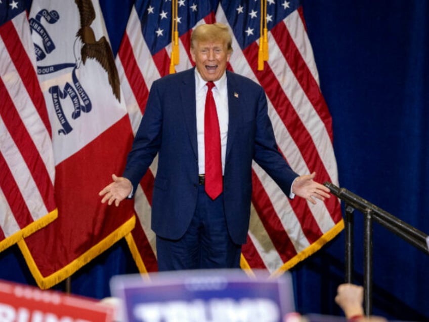 Former US President and 2024 Republican presidential hopeful Donald Trump arrives for a "Commit to Caucus" rally at the North Iowa Events Center in Mason City, Iowa, on January 5, 2024. (Photo by Christian MONTERROSA / AFP) (Photo by CHRISTIAN MONTERROSA/AFP via Getty Images)