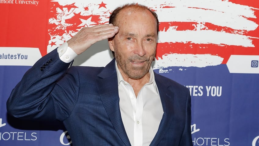 Lee Greenwood saluting