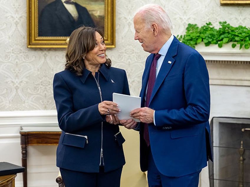 President Joe Biden talks with Vice President Kamala Harris before a meeting with Congress