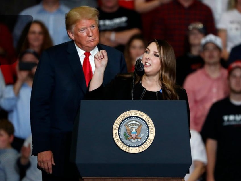 President Donald Trump listens as Chair of the Republican National Committee, Ronna McDani