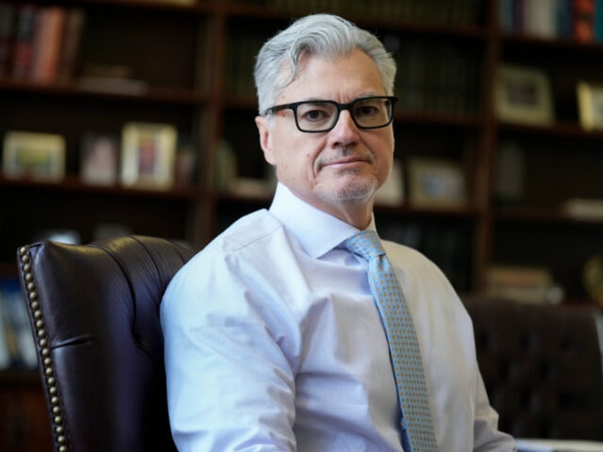 Judge Juan Merchan poses for a picture in his chambers in New York, Thursday, March 14, 20