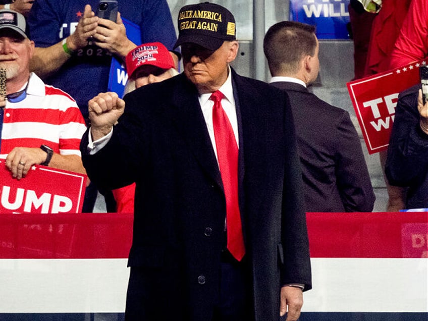 Former US President Donald Trump arrives for a campaign event at Atrium Health Amphitheate