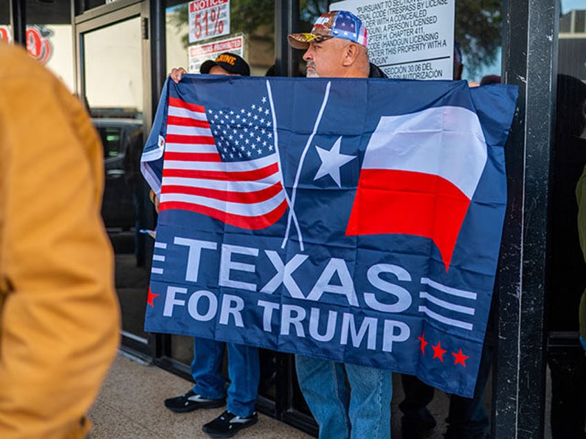 Supporters of former US President and 2024 presidential hopeful Donald Trump gather near S