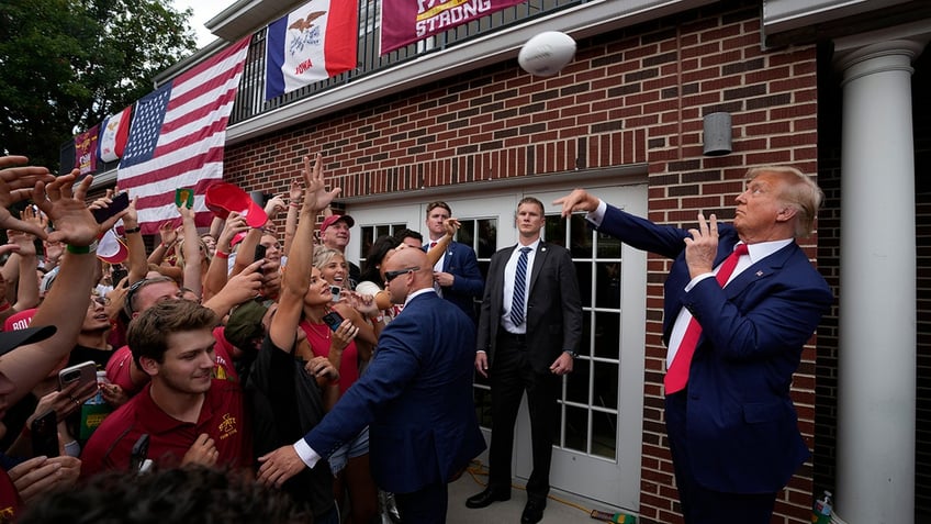 donald trump tailgates before iowa iowa state game crowd goes crazy as he walks into stadium