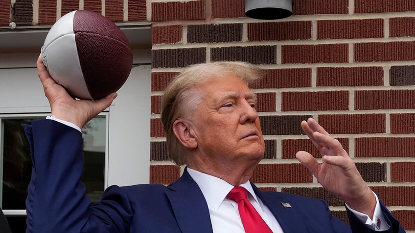 donald trump tailgates before iowa iowa state game crowd goes crazy as he walks into stadium