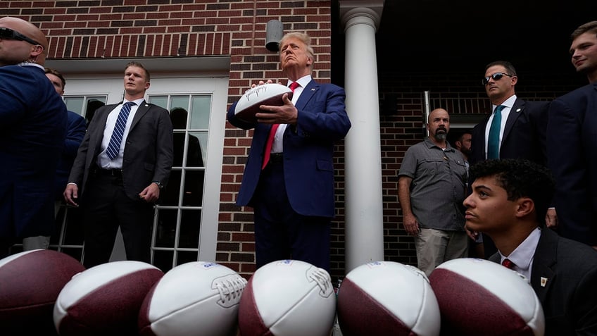 donald trump tailgates before iowa iowa state game crowd goes crazy as he walks into stadium