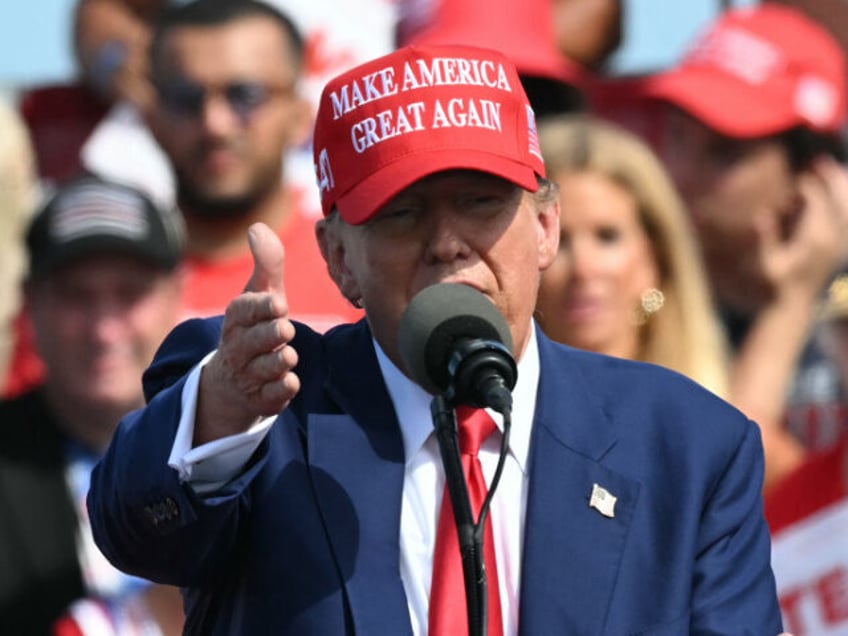 Former US President and Republican presidential candidate Donald Trump speaks at a campaig