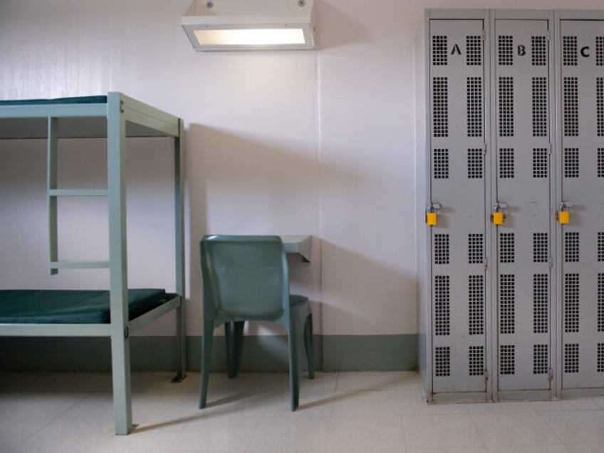 A bunk bed, desk and lockers inside a cell are seen at the Caroline Detention Facility in